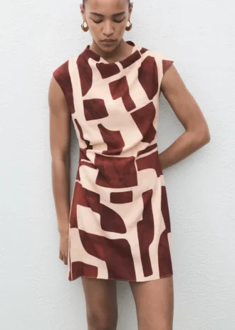 Abito stampato con scollo drappeggiato