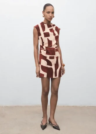 Abito stampato con scollo drappeggiato