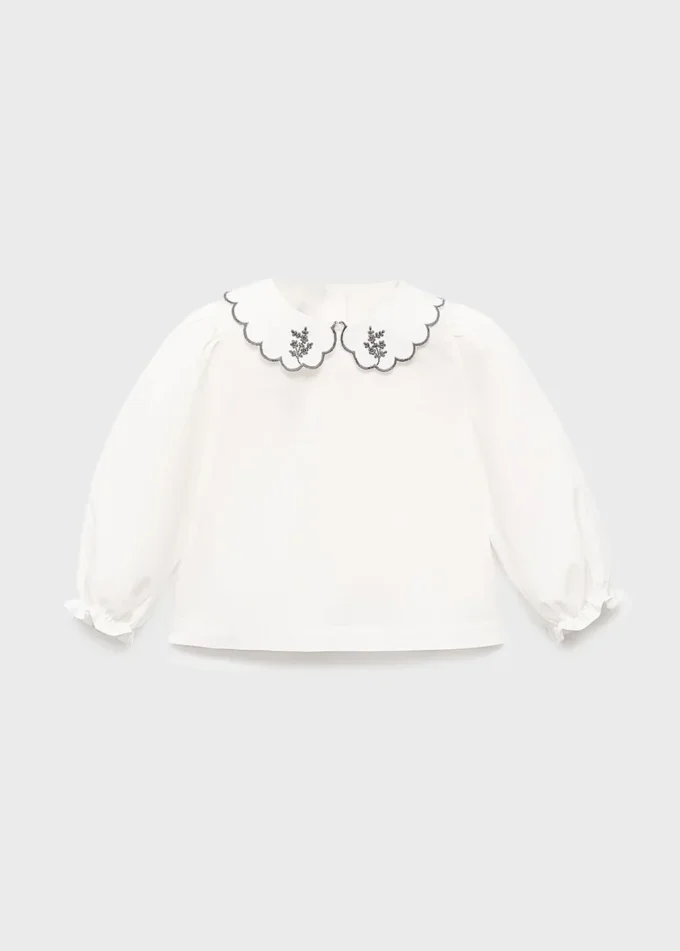 Camicetta con collo babydoll ricamato Camicetta con collo babydoll ricamato