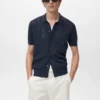 Camicia a righe in maglia con motivo traforato Camicia a righe in maglia con motivo traforato