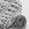 Cappello con pompon e motivo jacquard