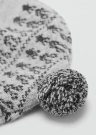 Cappello con pompon e motivo jacquard