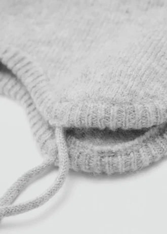 Cappello con pompon e motivo jacquard