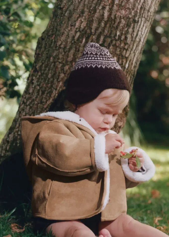 Cappello con pompon e motivo jacquard