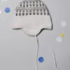 Cappello con pompon e motivo jacquard