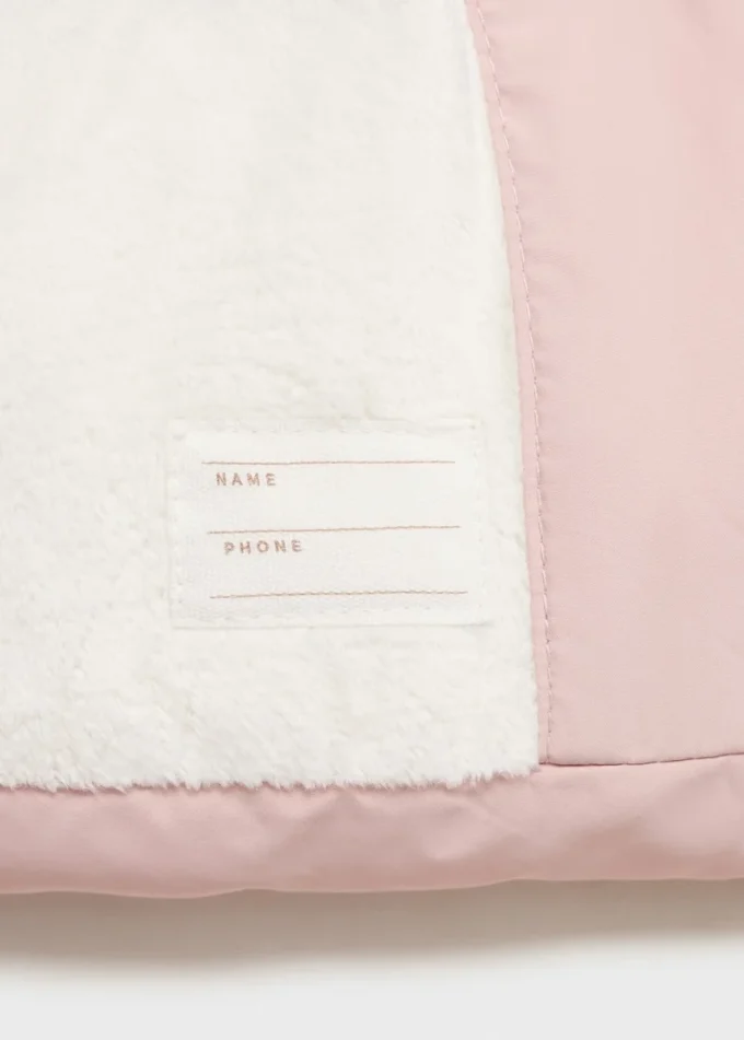 Giacca a vento con cappuccio effetto shearling Giacca a vento con cappuccio effetto shearling