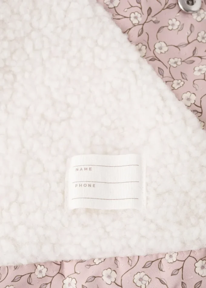 Giacca a vento foderata in shearling con motivo floreale Giacca a vento foderata in shearling con motivo floreale