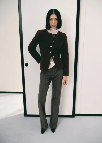 Giacca bouclé con bottoni gioiello