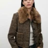 Giacca in tweed con collo in pelliccia Giacca in tweed con collo in pelliccia