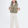 Gilet trapuntato con cappuccio Gilet trapuntato con cappuccio