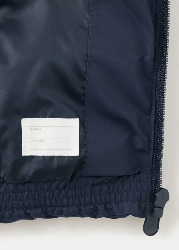 Gilet trapuntato con cappuccio Gilet trapuntato con cappuccio