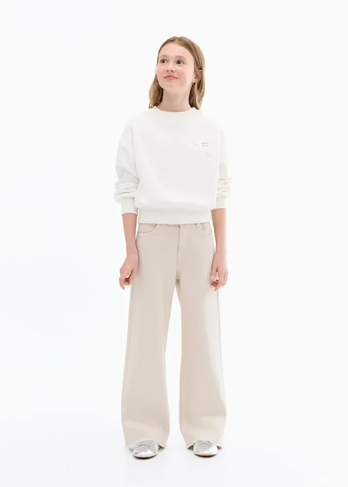 Jeans a gamba larga con orlo sfrangiato