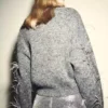 Maglione lavorato a maglia con piume Maglione lavorato a maglia con piume