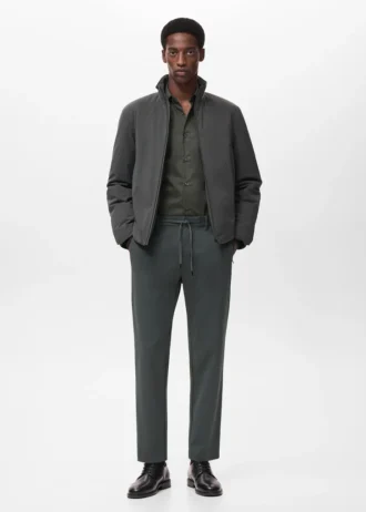 Pantaloni slim fit in tessuto elasticizzato con coulisse