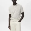 Polo in maglia di cotone con motivo traforato Polo in maglia di cotone con motivo traforato