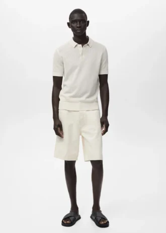 Polo in maglia di cotone con motivo traforato