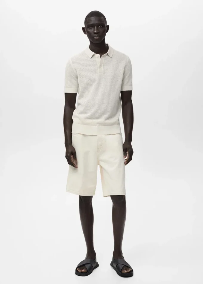 Polo in maglia di cotone con motivo traforato Polo in maglia di cotone con motivo traforato