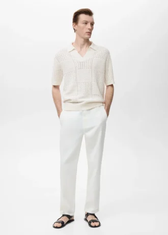 Polo in maglia di cotone con motivo traforato