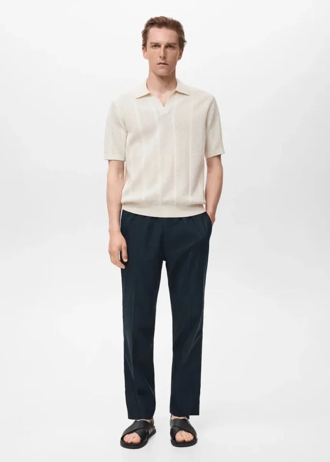 Polo in maglia di cotone con motivo traforato Polo in maglia di cotone con motivo traforato