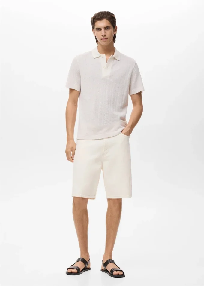 Polo in maglia di cotone con motivo traforato Polo in maglia di cotone con motivo traforato