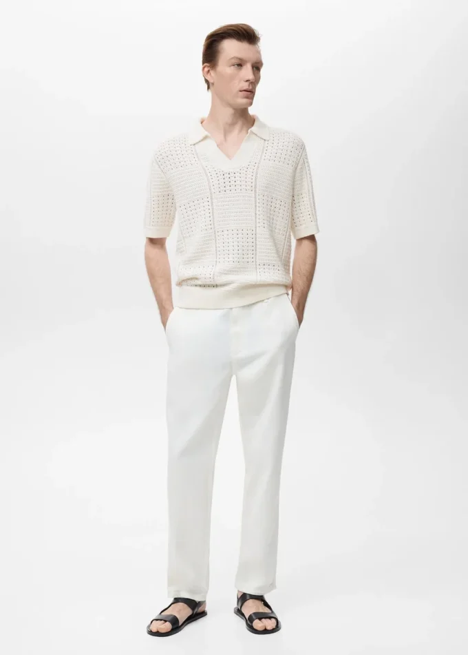 Polo in maglia di cotone con motivo traforato Polo in maglia di cotone con motivo traforato