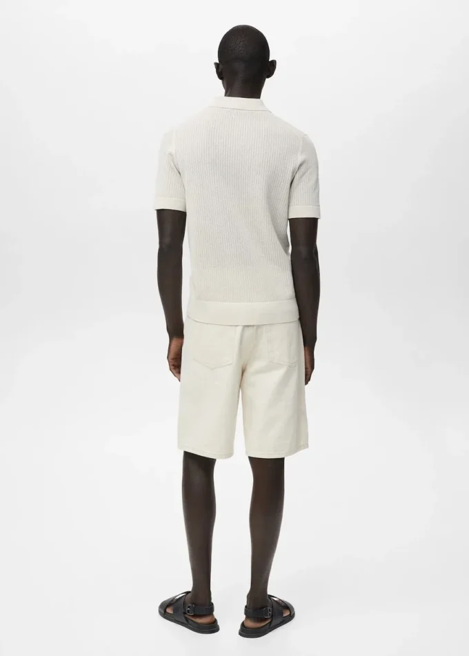 Polo in maglia di cotone con motivo traforato Polo in maglia di cotone con motivo traforato