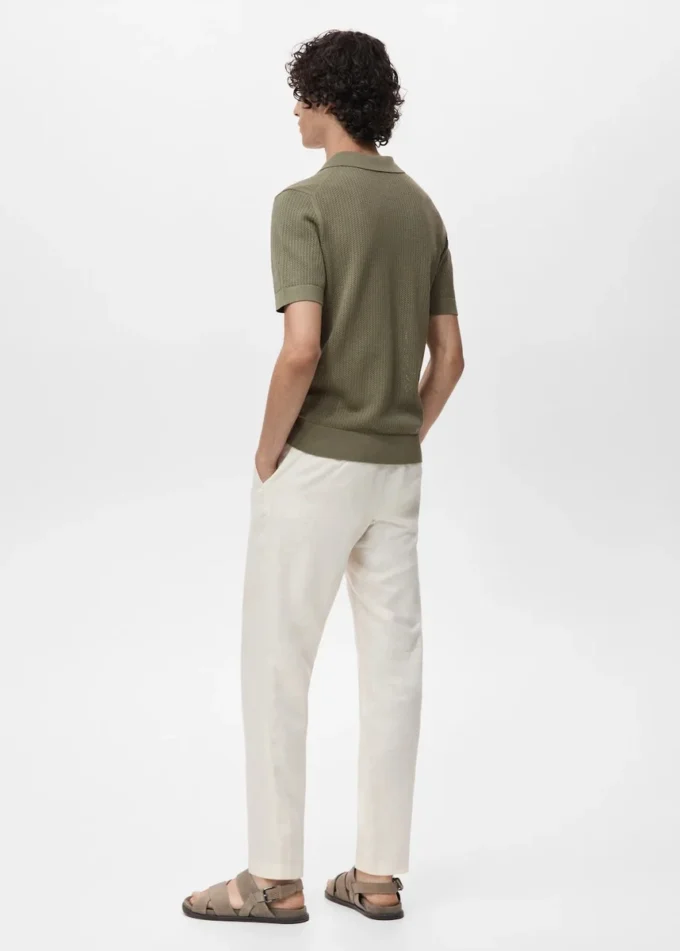 Polo in maglia di cotone con motivo traforato Polo in maglia di cotone con motivo traforato