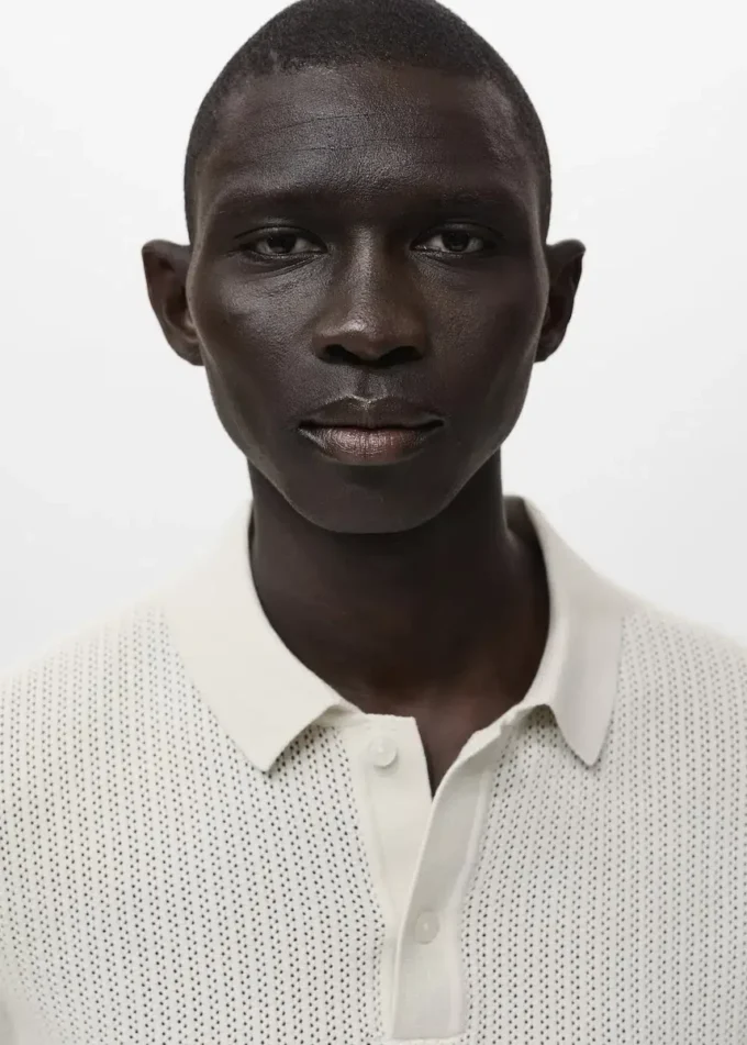 Polo in maglia di cotone con motivo traforato Polo in maglia di cotone con motivo traforato