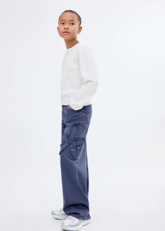 T-shirt a maniche lunghe con volant T-shirt a maniche lunghe con volant