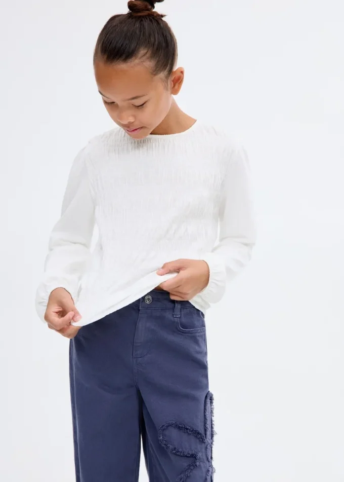 T-shirt a maniche lunghe con volant T-shirt a maniche lunghe con volant