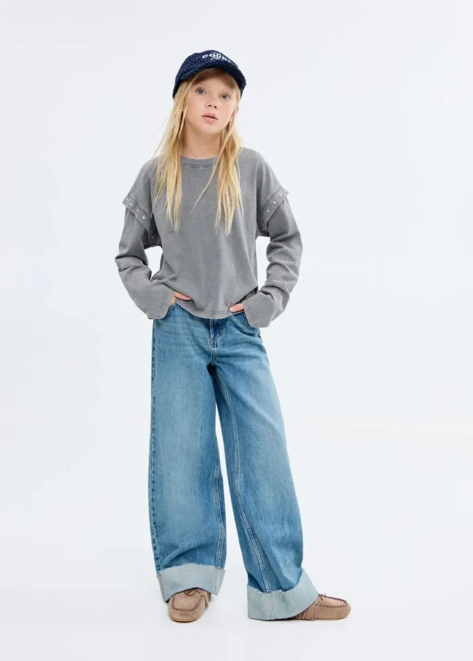 T-shirt con dettagli in perline T-shirt con dettagli in perline