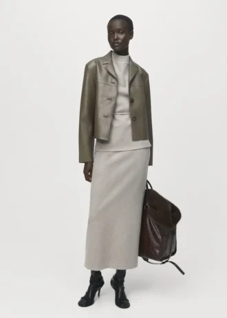 Top a collo alto con cintura