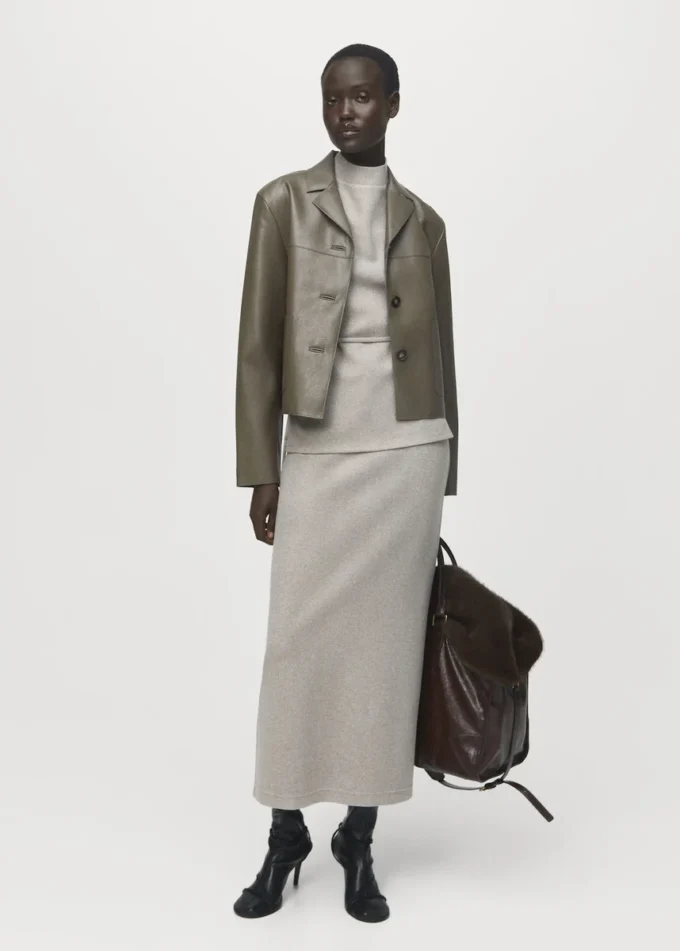 Top a collo alto con cintura