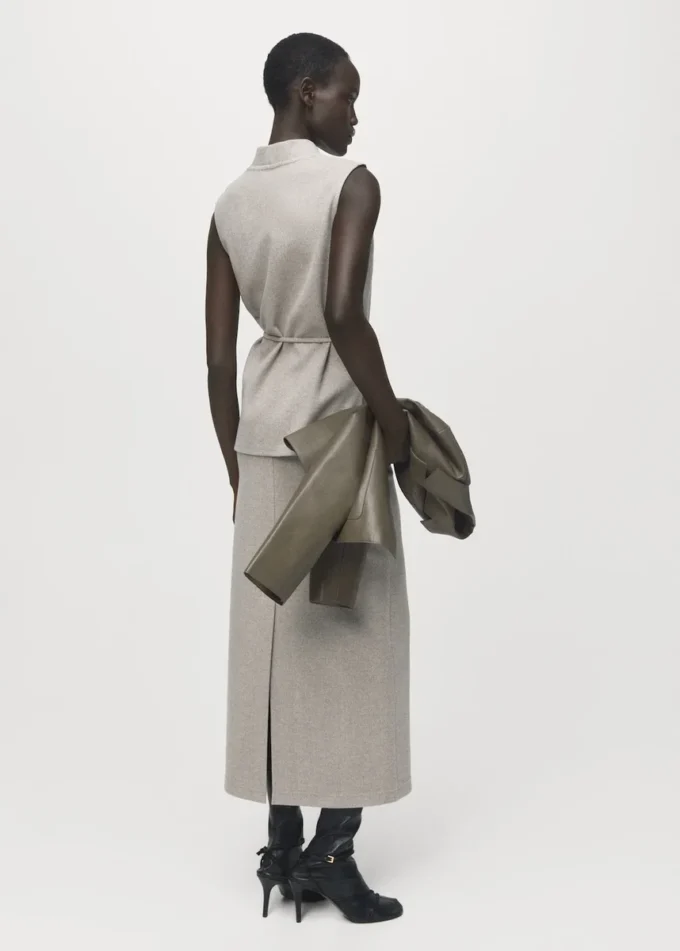 Top a collo alto con cintura