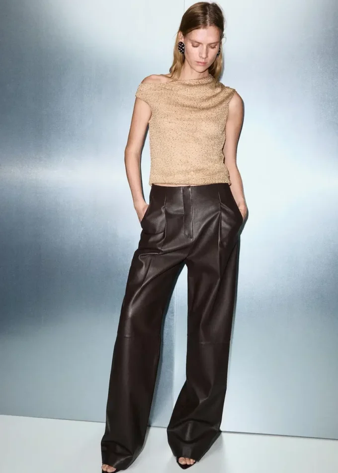 Top asimmetrico con paillettes Top asimmetrico con paillettes